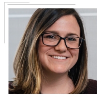 woman smiling wearing glasses